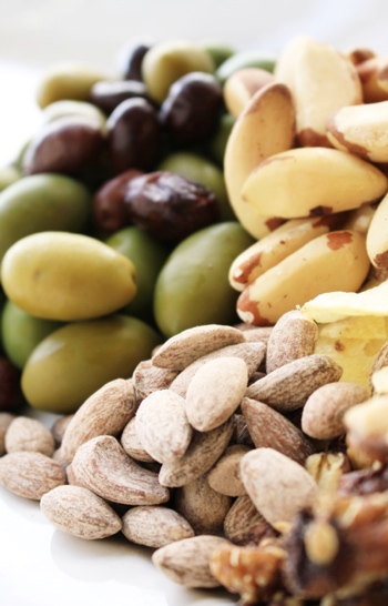 Variety of Fresh Olives and Raw Nuts